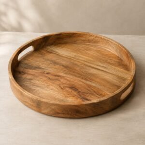 Plateau rond en manguier, 40 cm, shown on a plain studio background
